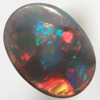SOLID BLACK OPAL Gemmy fire of red, green and blue SEE VIDEO